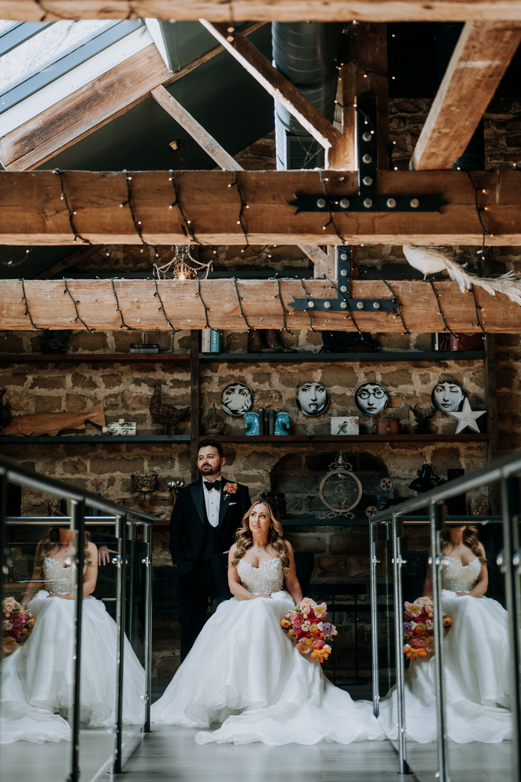 Bride & Groom standing inside the barn at Wharfedale Grange