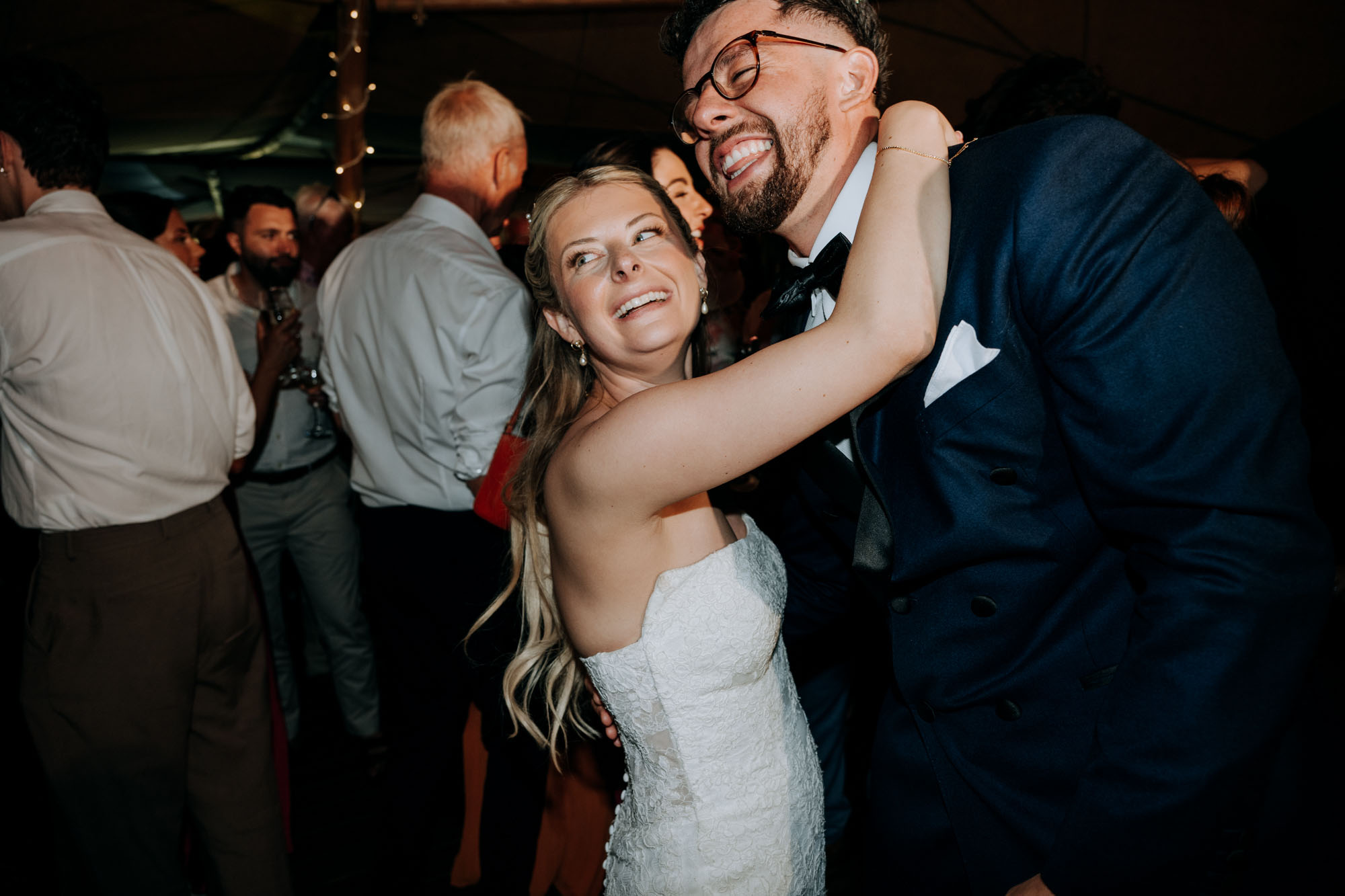 Scrivelsby Walled Garden Wedding evening reception - Bride hugging guest