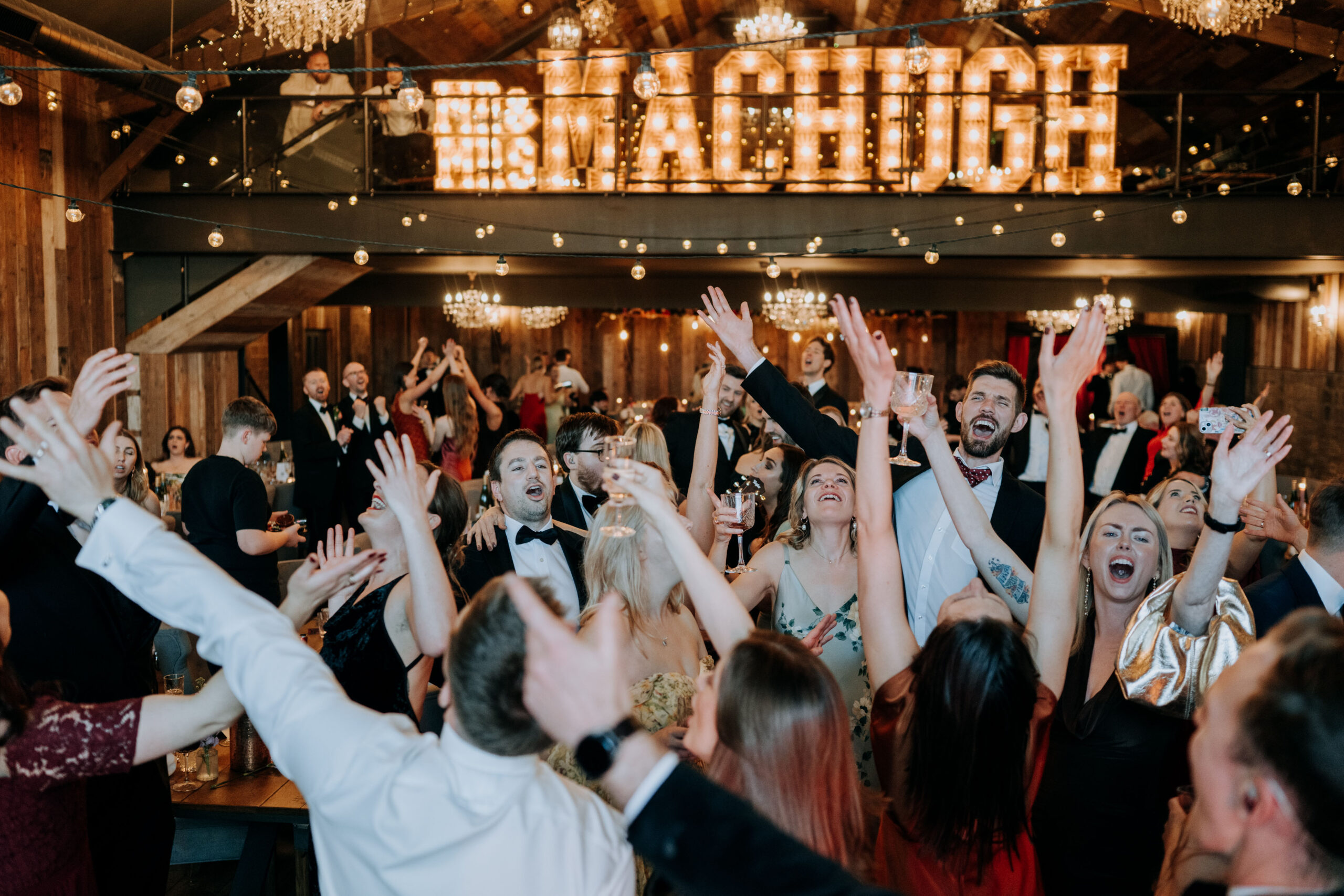 Guests celebrating with the bride and groom at Wharfedale Grange