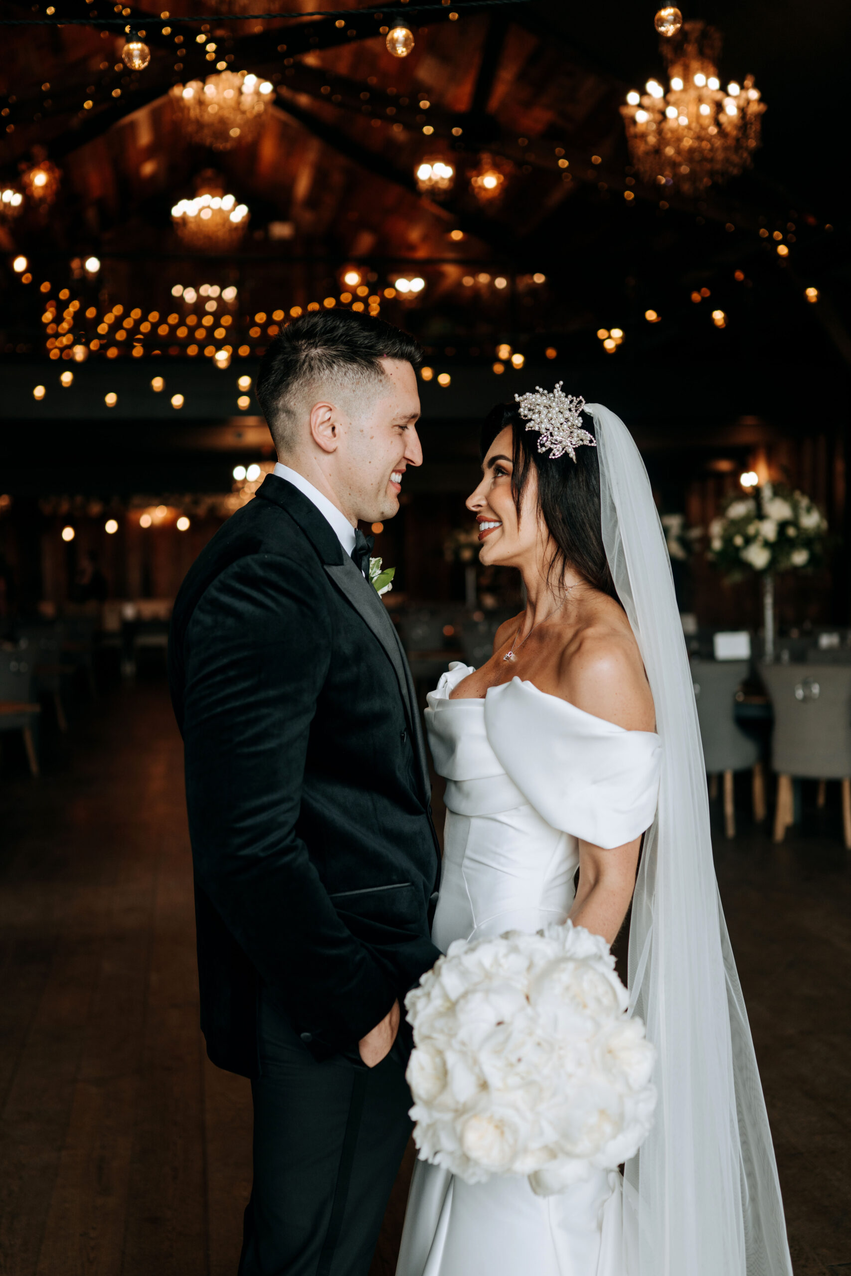 Bride and groom embracing during the evening reception at Wharfedale Grange